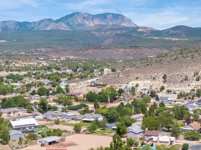 Mountain backdrop with a residential area featuring multiple single-family homes