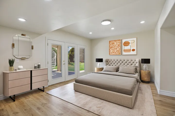 Recessed lighting, wood-finish flooring, and French doors leading to exterior