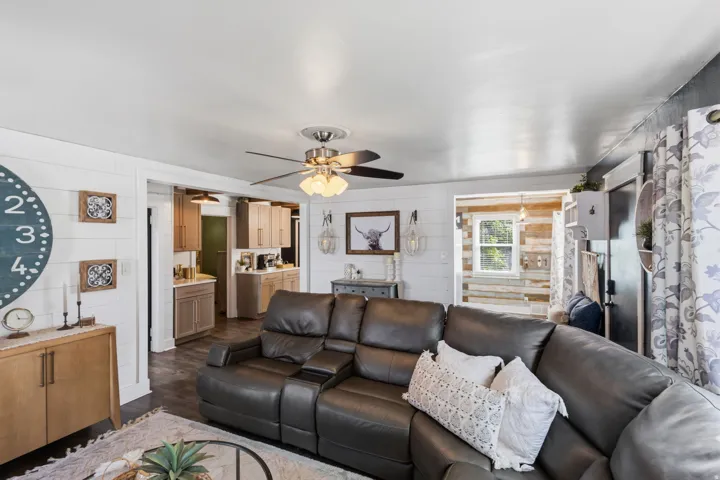 Open-concept living space with shiplap accent walls