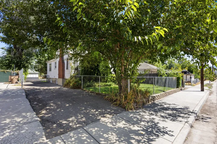 Paved driveway leading to the rear of the property