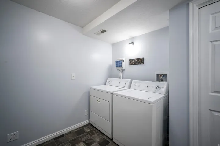 Recessed Lighting, neutral wall paint, and durable flooring
