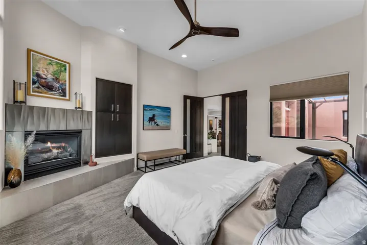 Primary Bedroom with gas fireplace and views of the Kayenta Cliffs