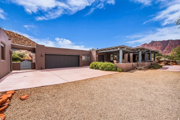 Front View of Property with attached garage and casita