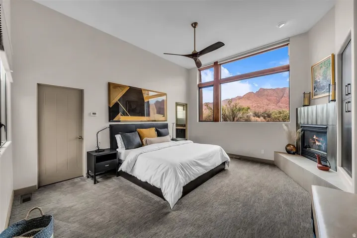 Primary Bedroom with gas fireplace and views of the Kayenta Cliffs
