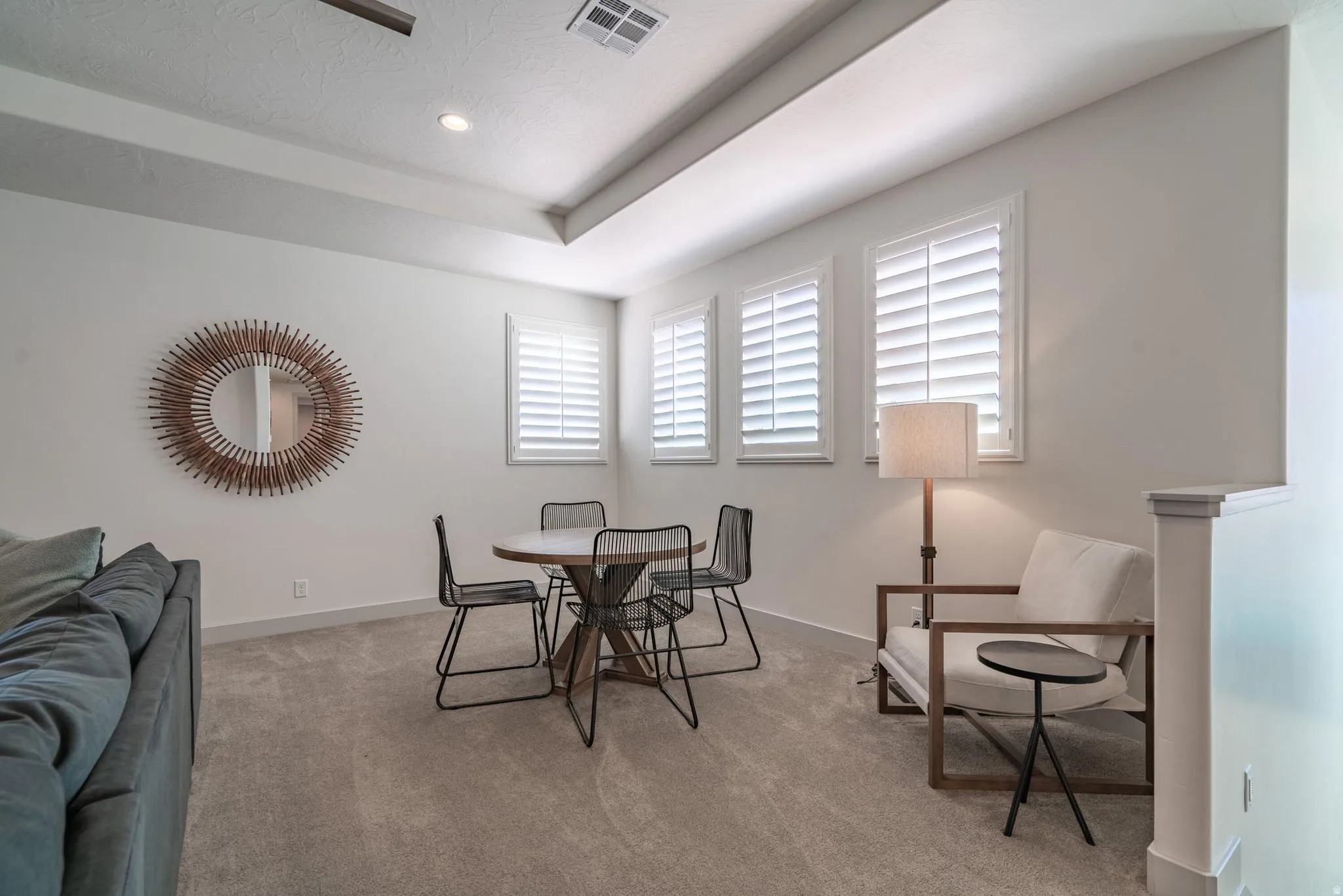2nd Floor Family Room with recessed lighting, tray ceiling, two ceiling fans, sliding glass doors, dining area and carpet flooring