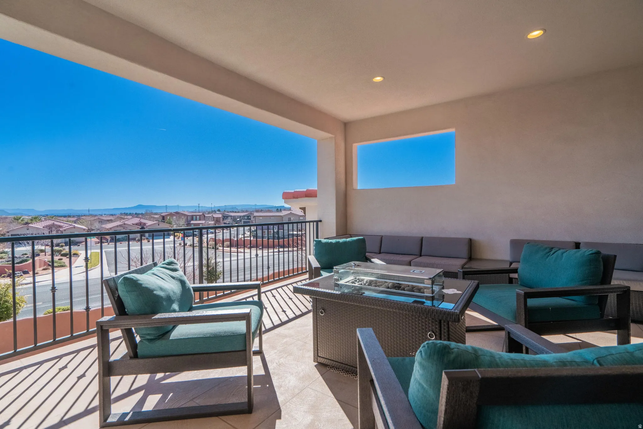 Expansive outdoor balcony with recessed lighting