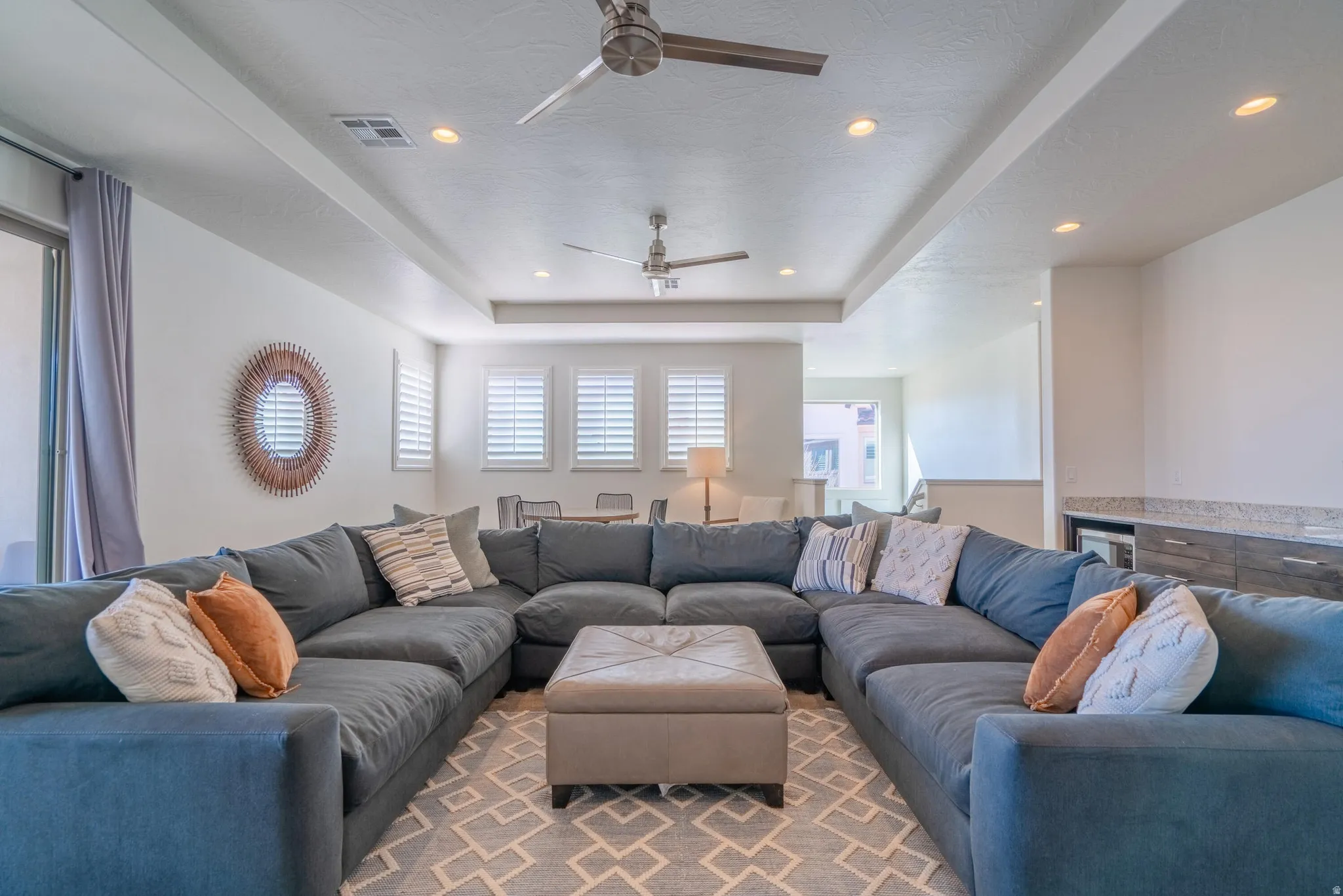 2nd Floor Family Room with recessed lighting, tray ceiling, two ceiling fans, sliding glass doors, and carpet flooring