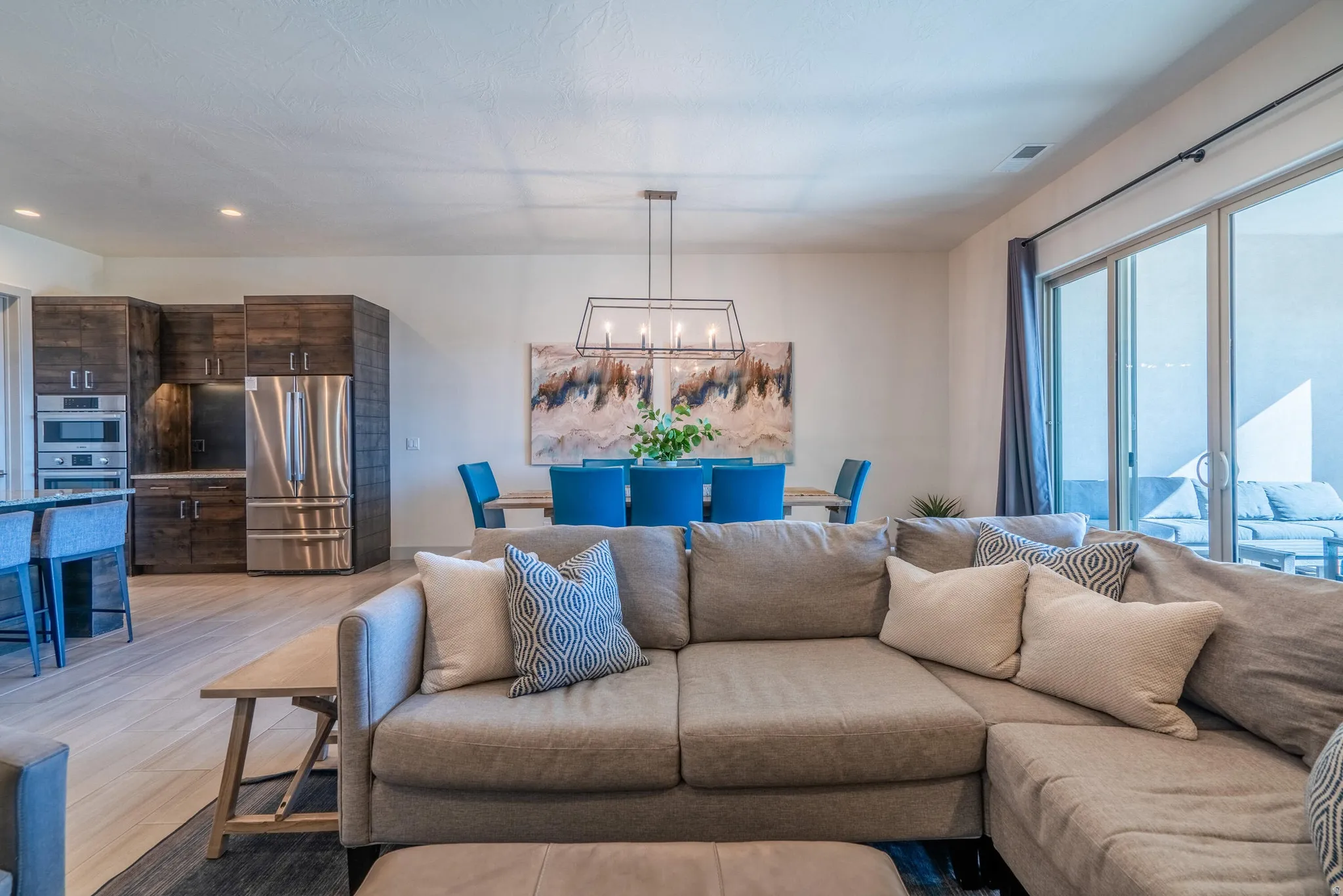 Recessed lighting, wood-finish flooring and sliding glass doors