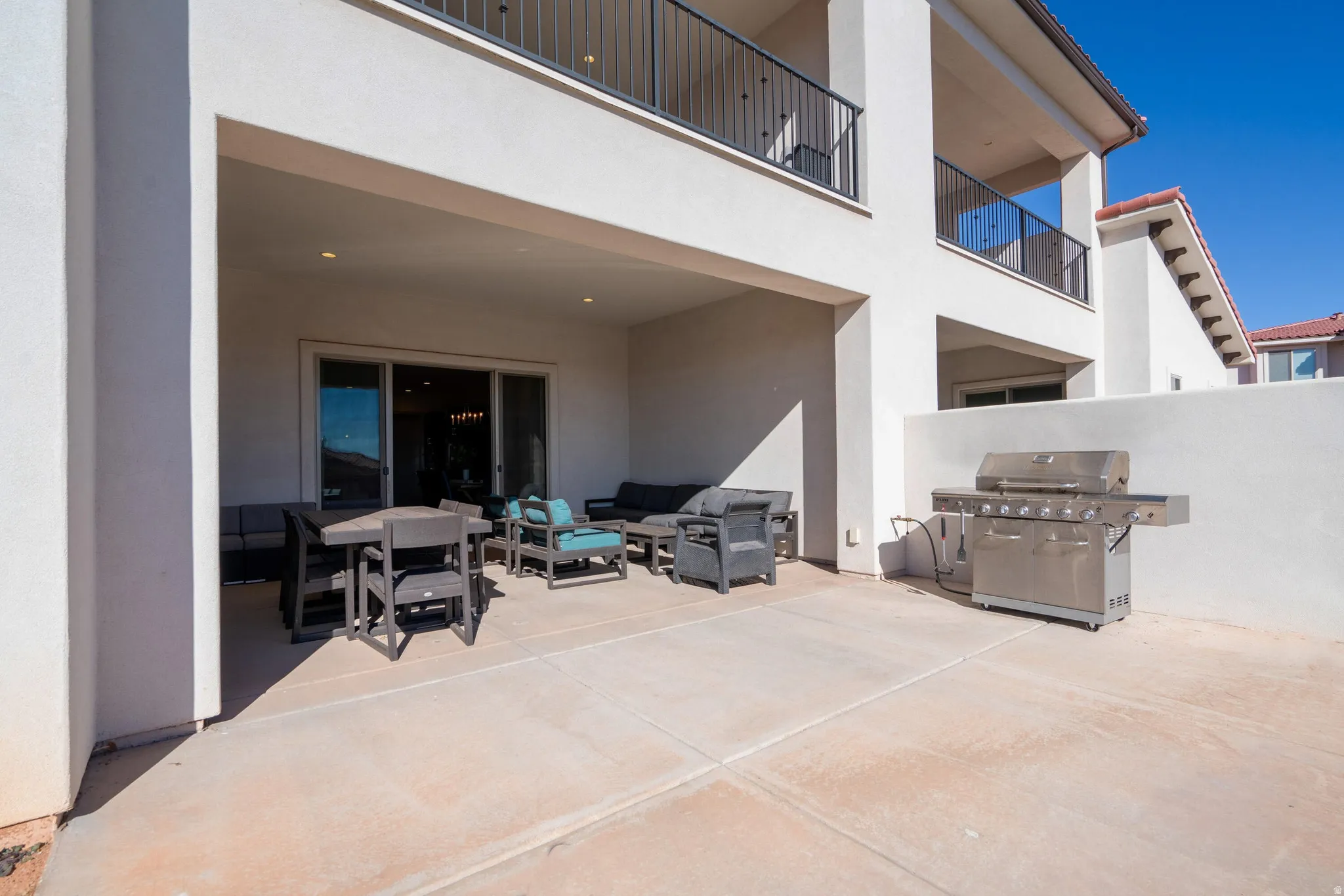 Covered patio featuring recessed lighting and a sliding glass doors