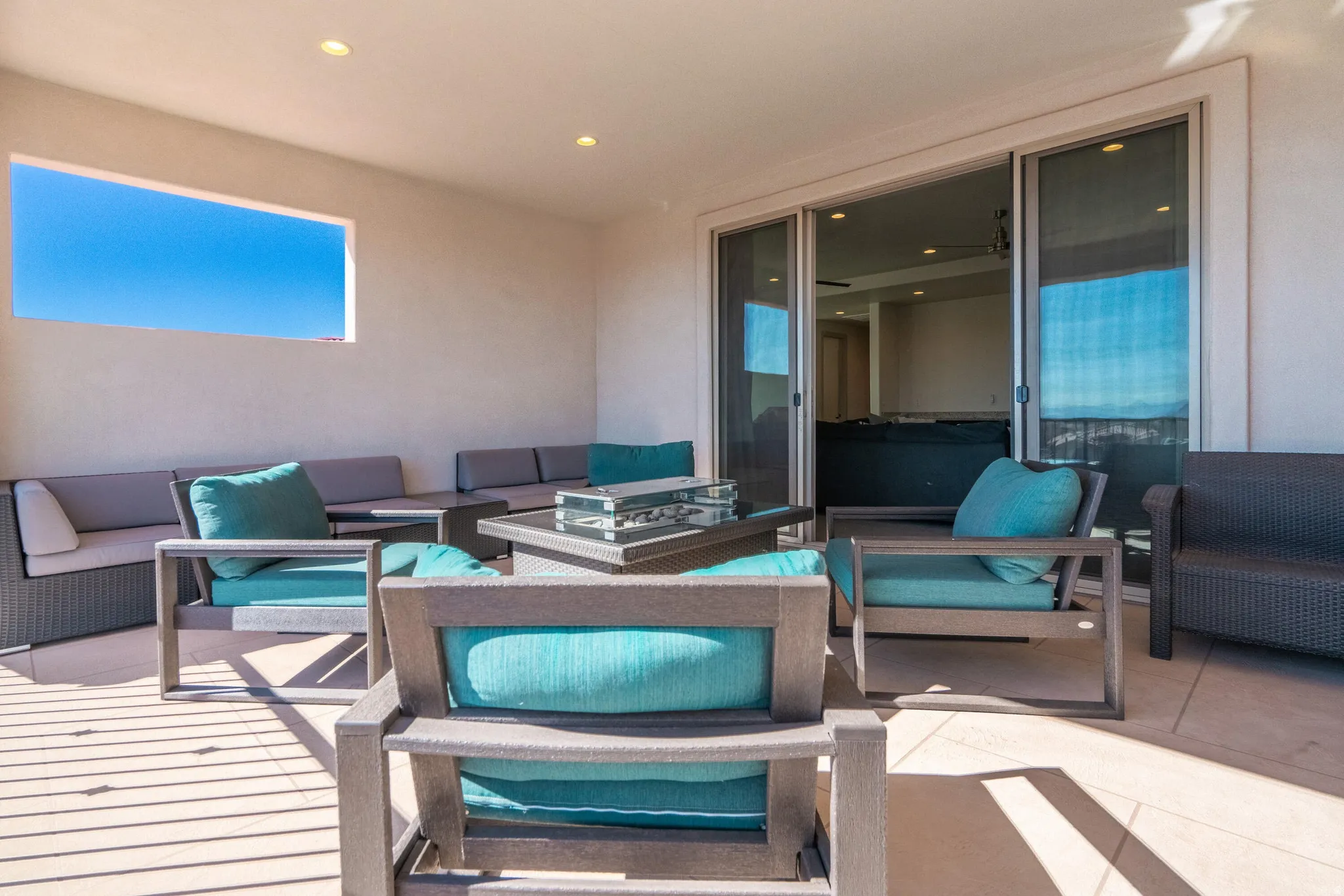Expansive outdoor balcony with recessed lighting
