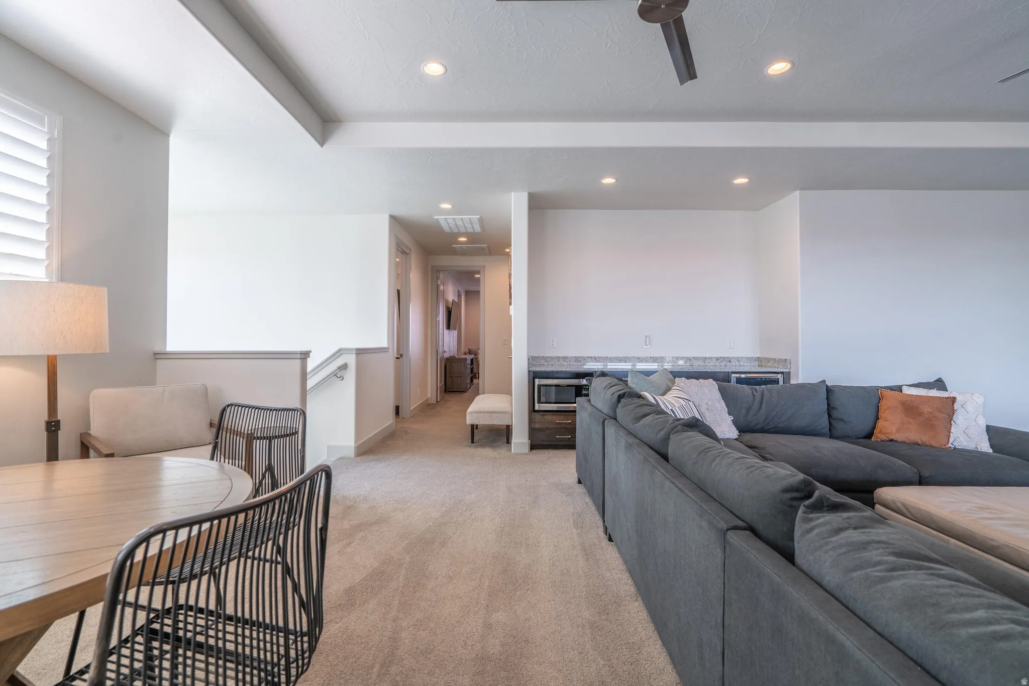 2nd Floor Family Room with recessed lighting, tray ceiling, two ceiling fans, sliding glass doors, and carpet flooring