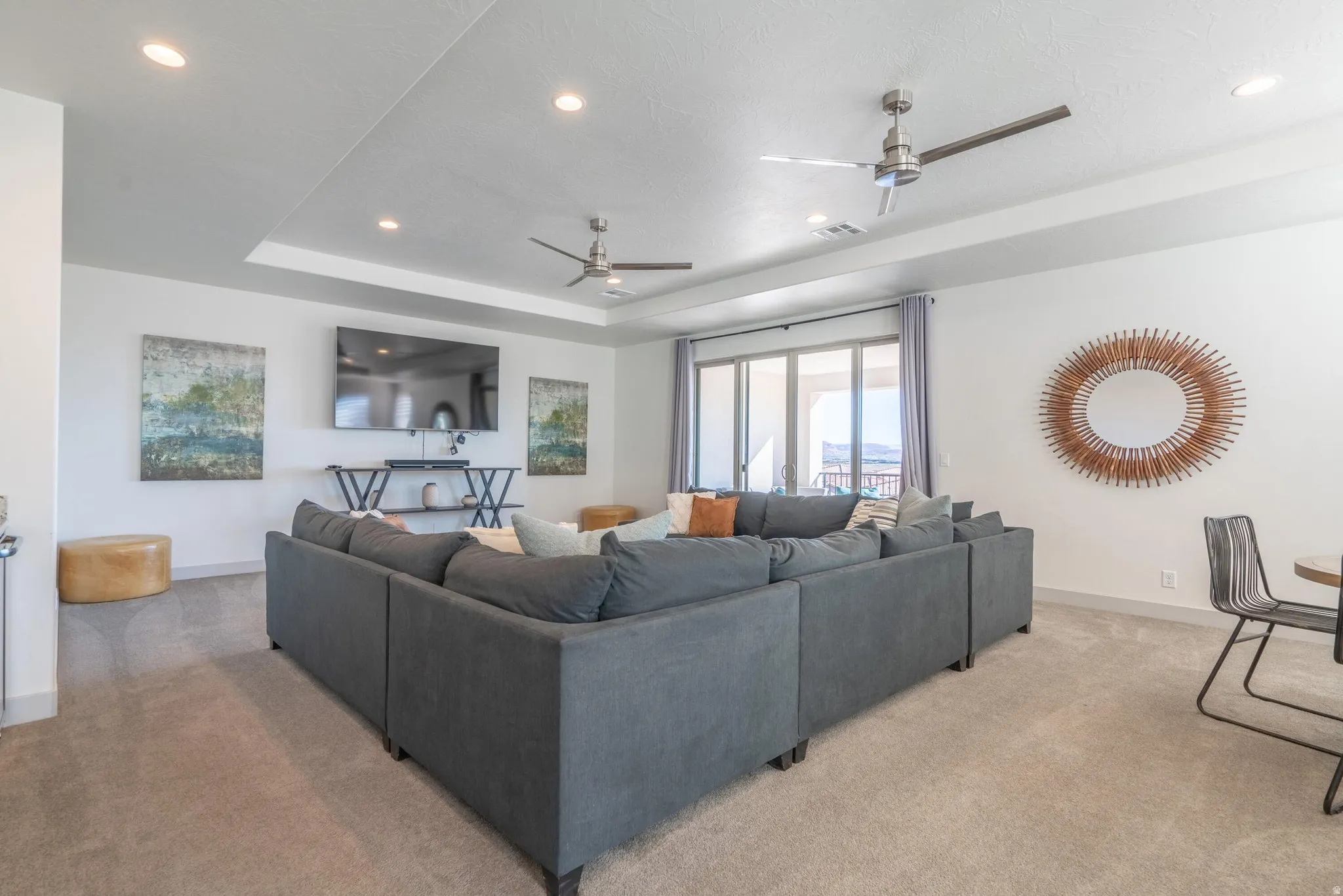 2nd Floor Family Room with recessed lighting, tray ceiling, two ceiling fans, sliding glass doors, and carpet flooring
