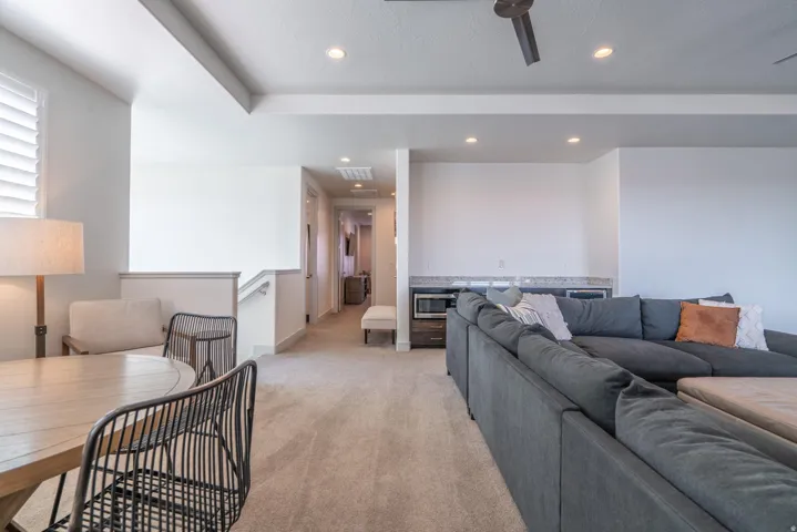 2nd Floor Family Room with recessed lighting, tray ceiling, two ceiling fans, sliding glass doors, and carpet flooring