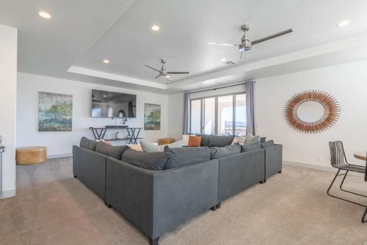 2nd Floor Family Room with recessed lighting, tray ceiling, two ceiling fans, sliding glass doors, and carpet flooring