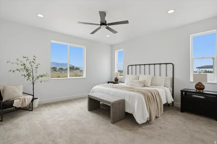 Recessed ceiling lighting, a ceiling fan, and multiple windows
