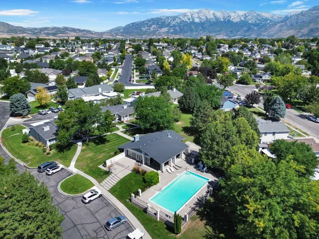 Community pool and clubhouse with mountain backdrop