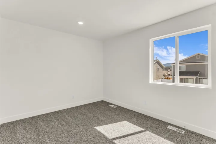 White walls with a single recessed ceiling light fixture