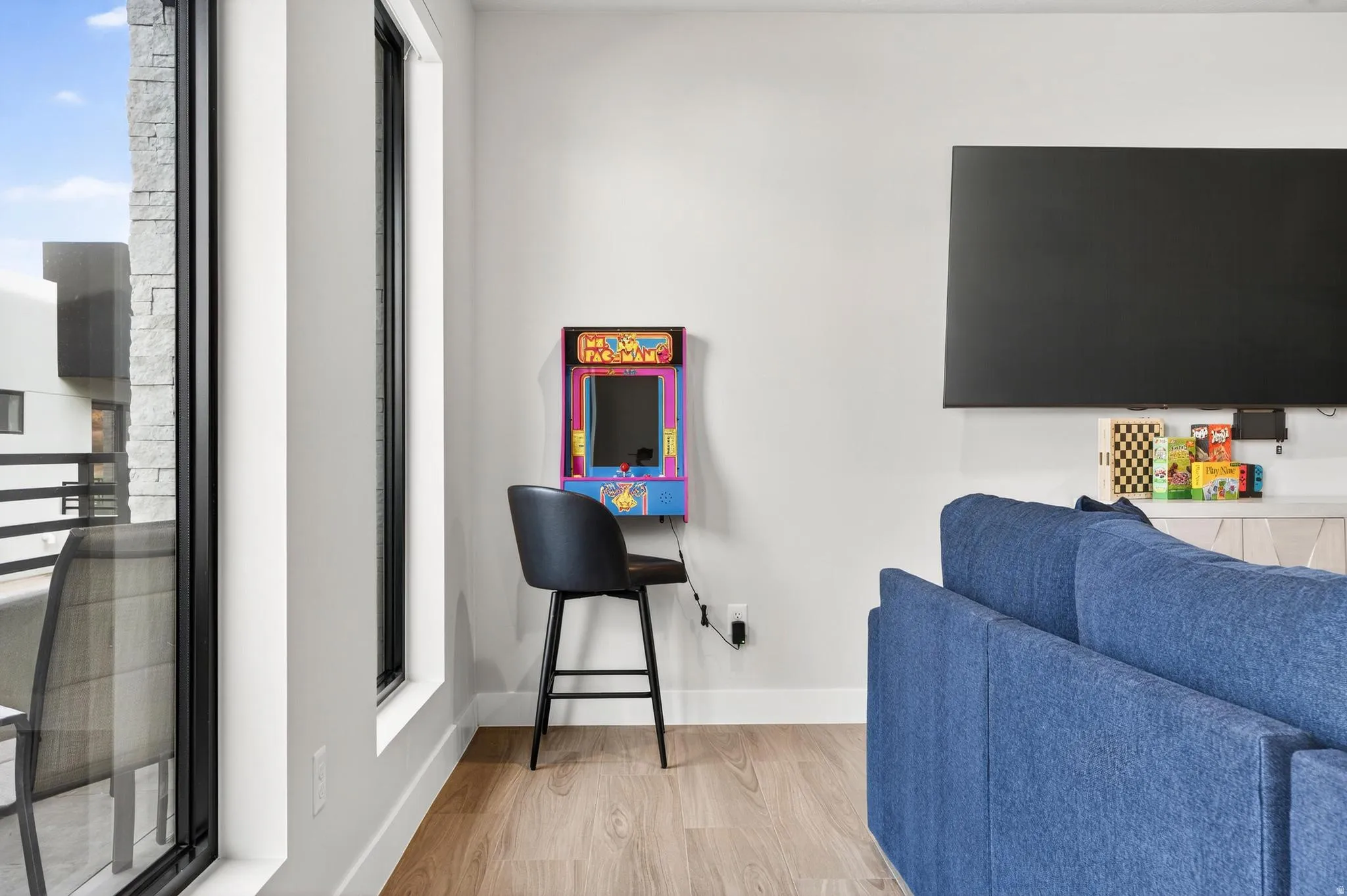 Wood-finish flooring with white baseboards