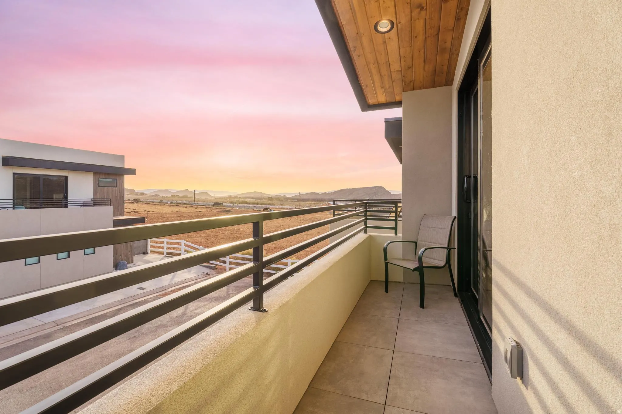 Balcony with a wood-finish ceiling, recessed lighting, and a sliding glass door