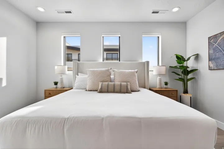 Recessed lighting, wood-finish flooring, and multiple windows