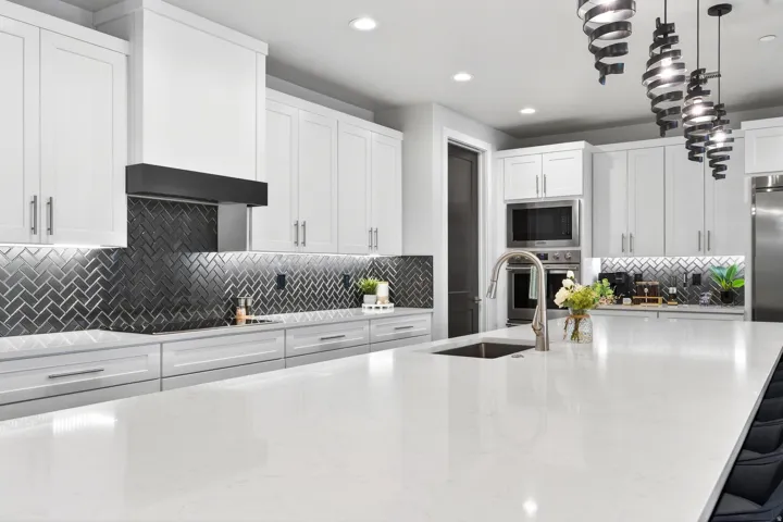 Spacious kitchen island with an integrated sink and gooseneck faucet