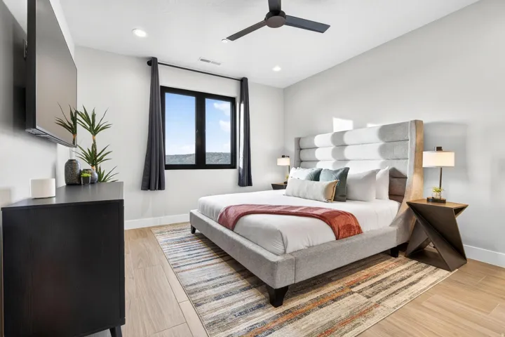 Recessed lighting, ceiling fan, wood-finish flooring, large window, and light-toned walls