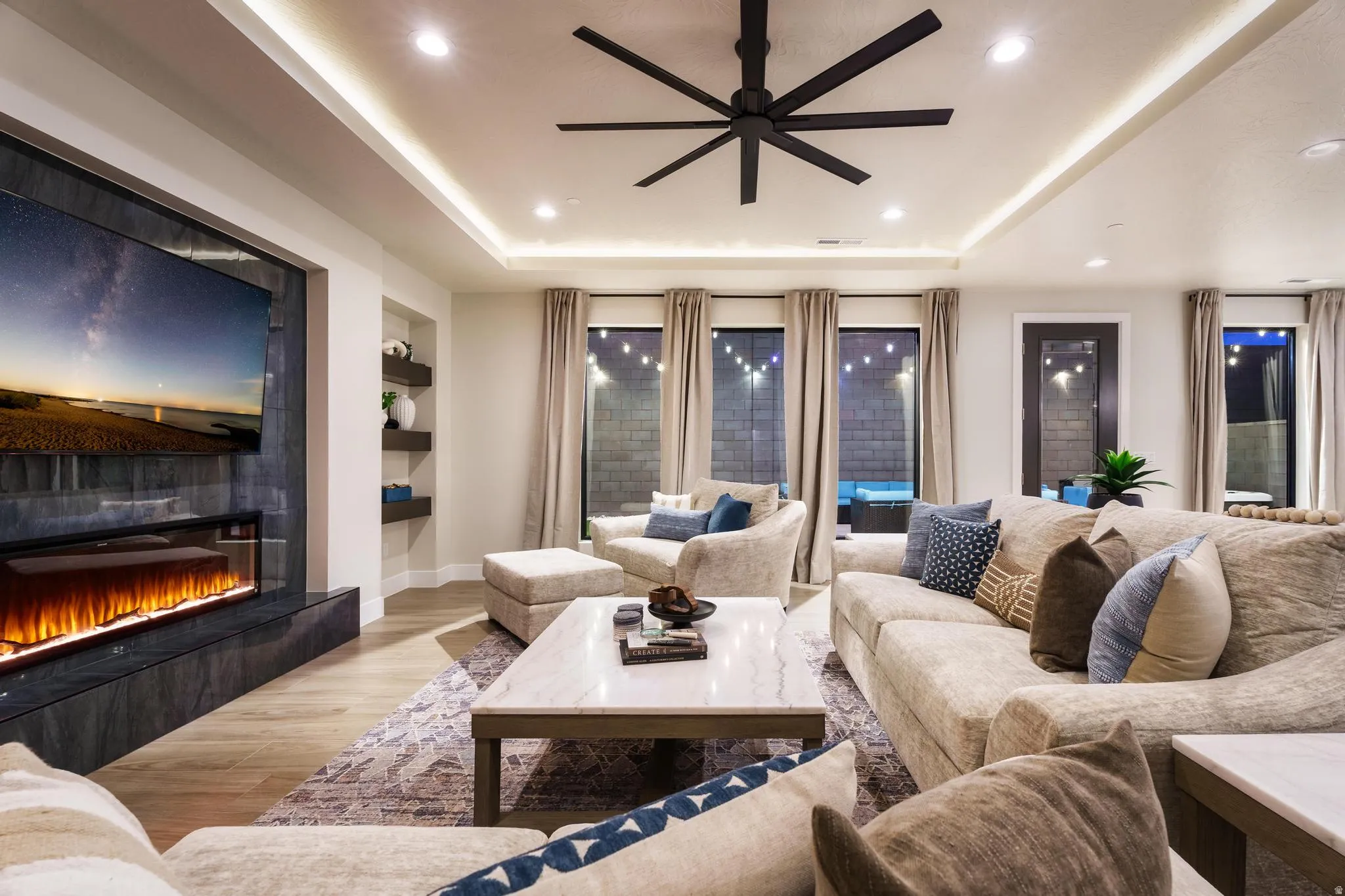 Tray ceiling with recessed lighting and a ceiling fan