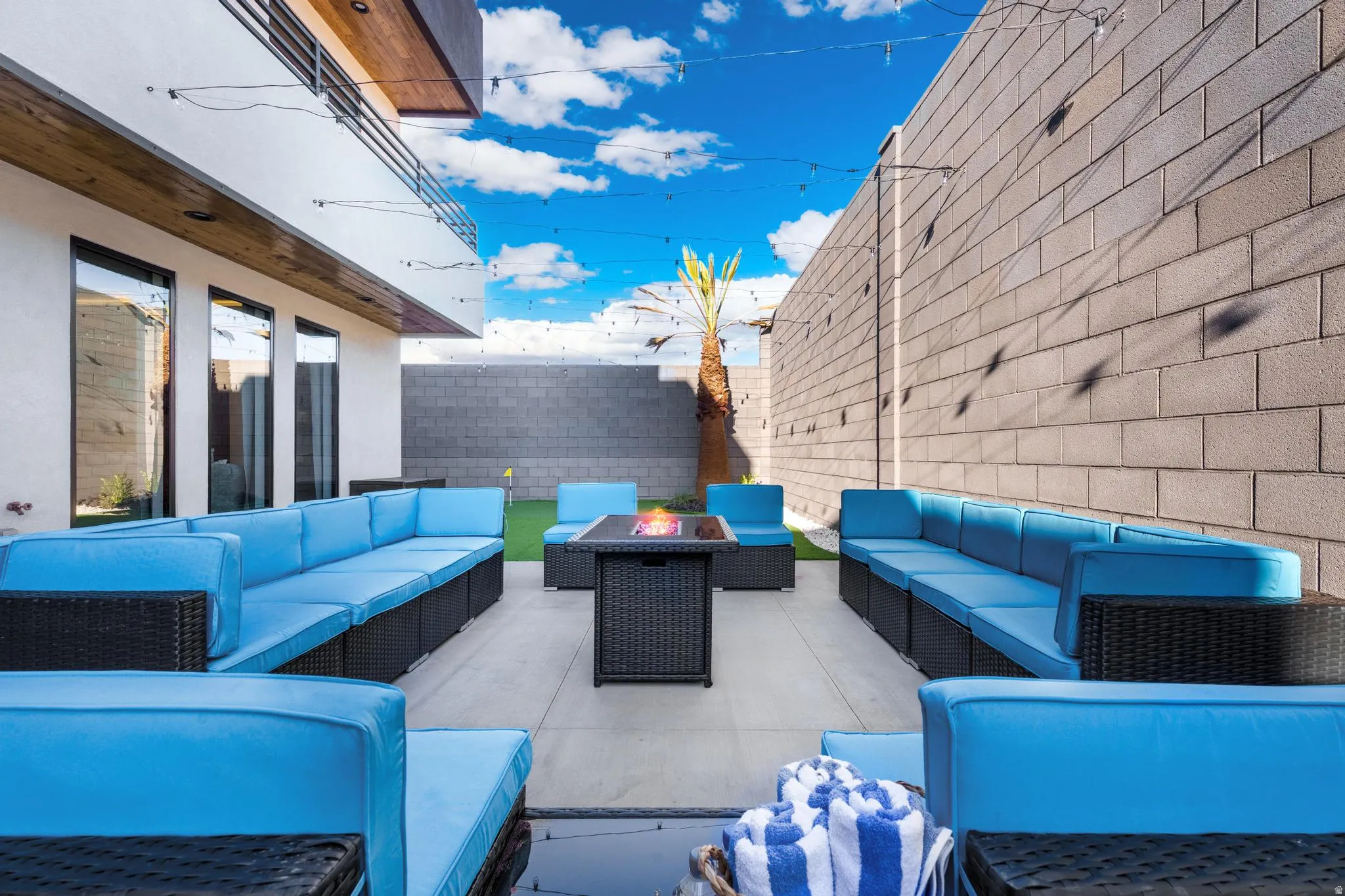 Paved patio area with a central fire pit feature
