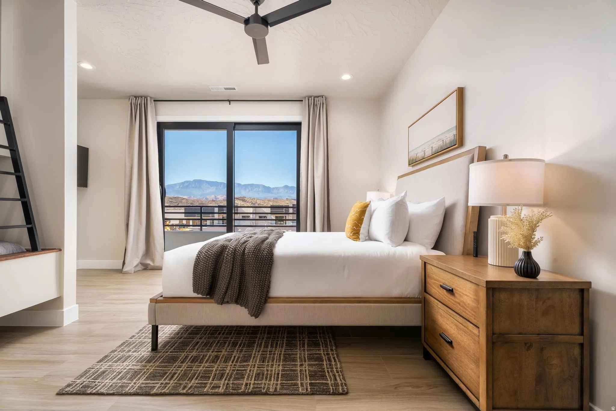 Wood-finish flooring, recessed lighting, and a modern ceiling fan