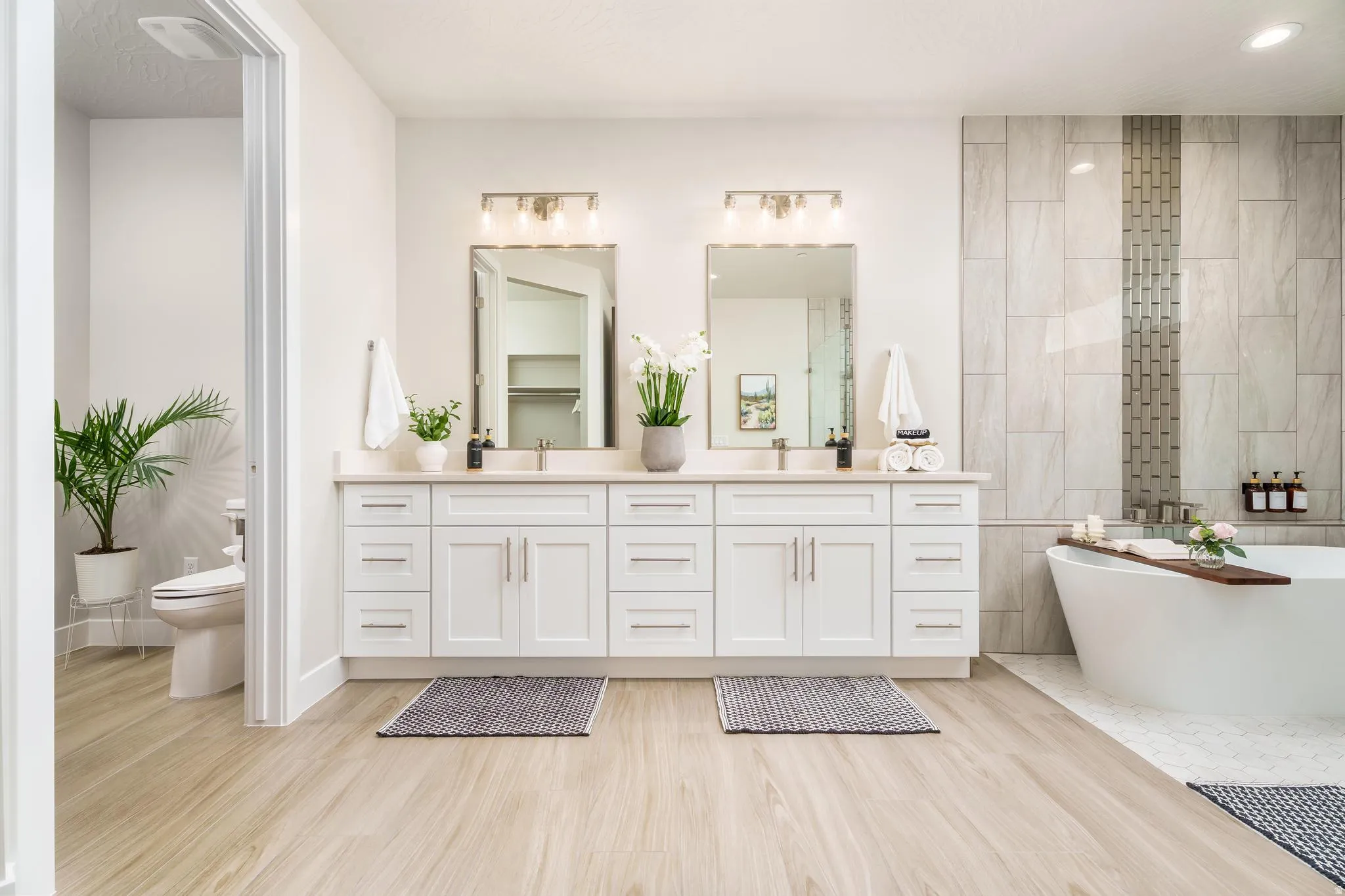 Dual vanity with white cabinetry and light-toned countertops