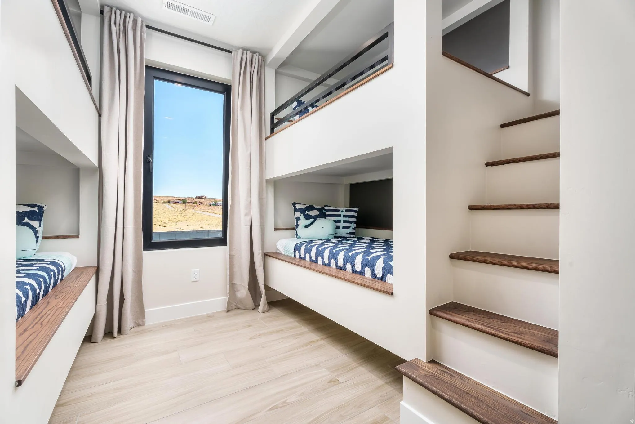 Built-in bunk beds with integrated wood-finish steps