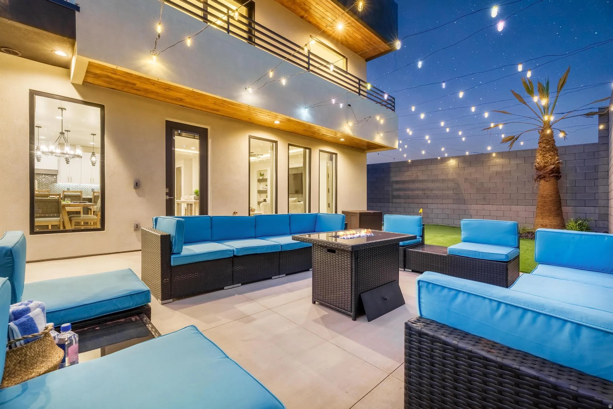Expansive outdoor patio with a paved surface and a compact grassy area
