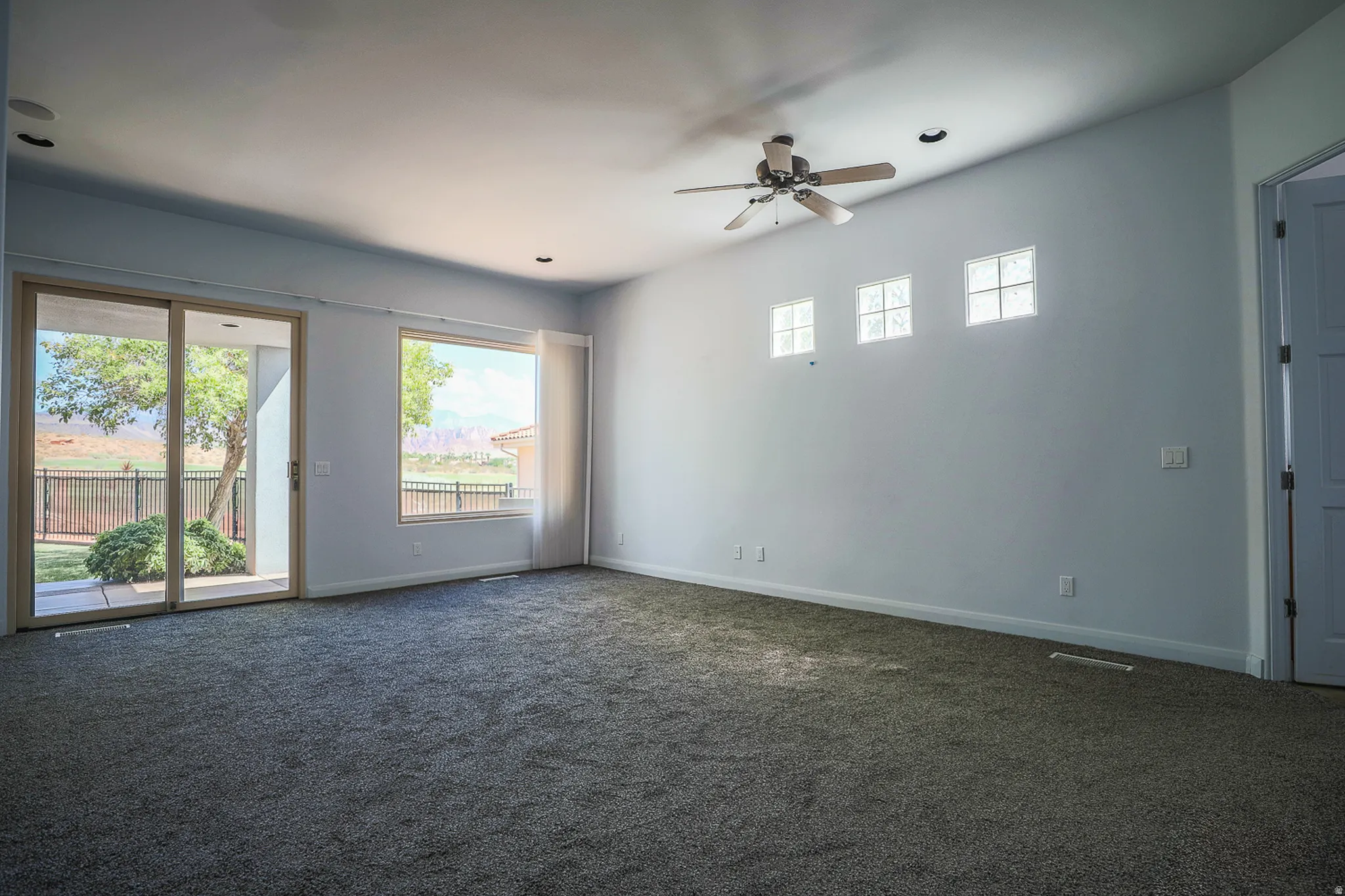 Primary bedroom with patio access (Pre-leasing photo)
