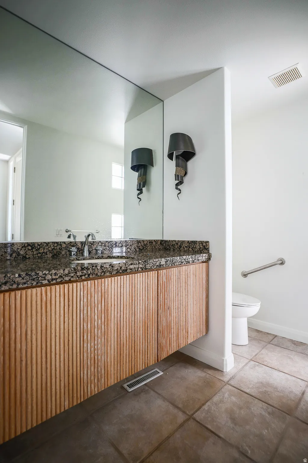 Half Bathroom in main living area (Pre-leasing photo)