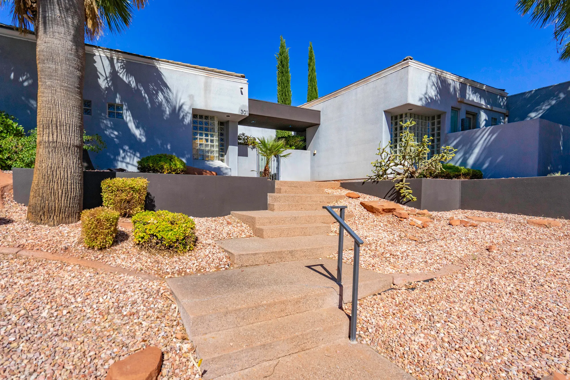 Modern exterior architecture with a flat roofline and light-colored stucco finish