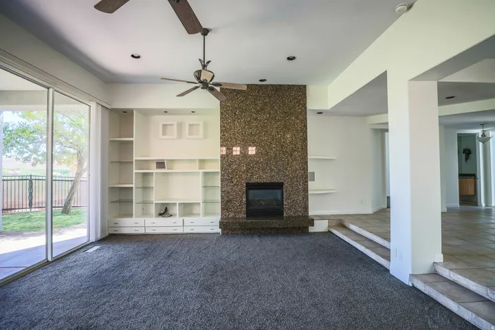 Great room with built in cabinetry, fireplace, (Pre-leasing photo)