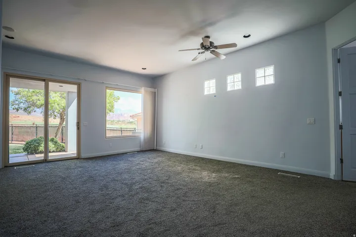 Primary bedroom with patio access (Pre-leasing photo)
