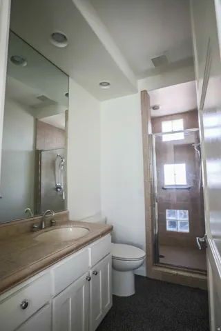 White vanity with dual cabinet storage and chrome hardware