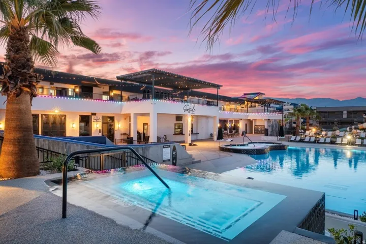 Expansive outdoor swimming pool with integrated hot tub