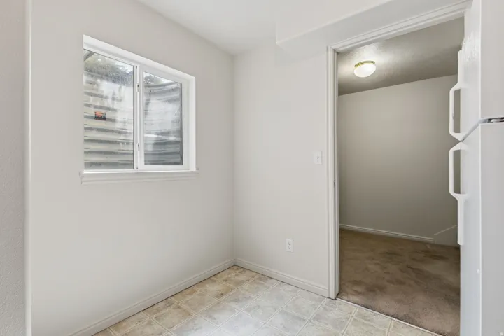 Tile flooring with a single window and trim