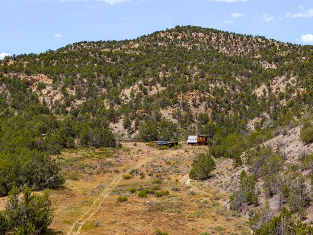 The headquarters site at the head of the draw, with the two-track access road running in from the south