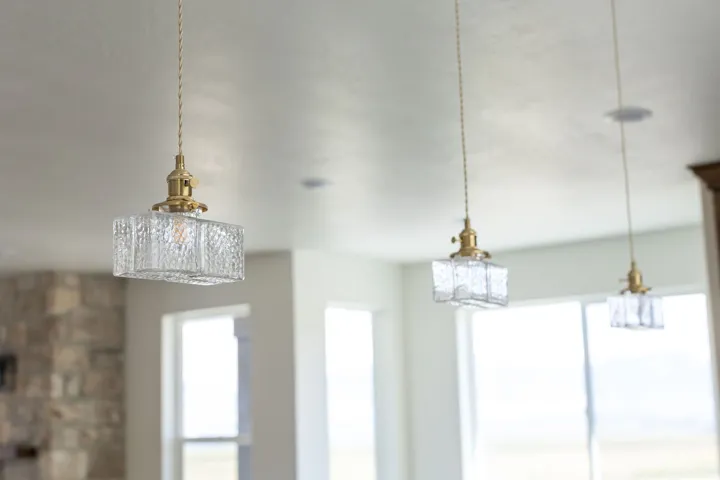 Textured glass pendant lighting with brass-finish hardware