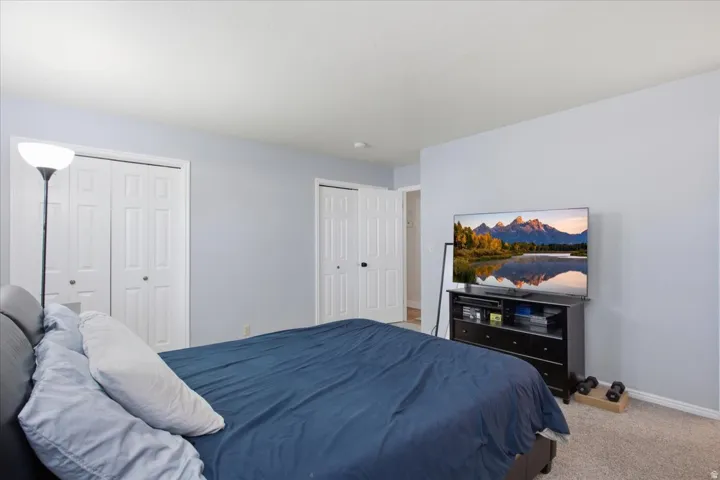 Light gray wall paint, carpeting, and white trim