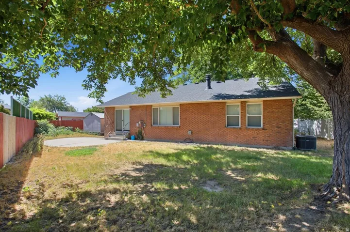 Charming brick ranch home set on a spacious lot shaded by mature trees