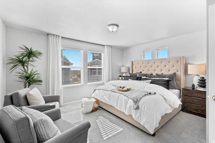 Recessed ceiling lighting, light gray wall paint, and light gray carpeting