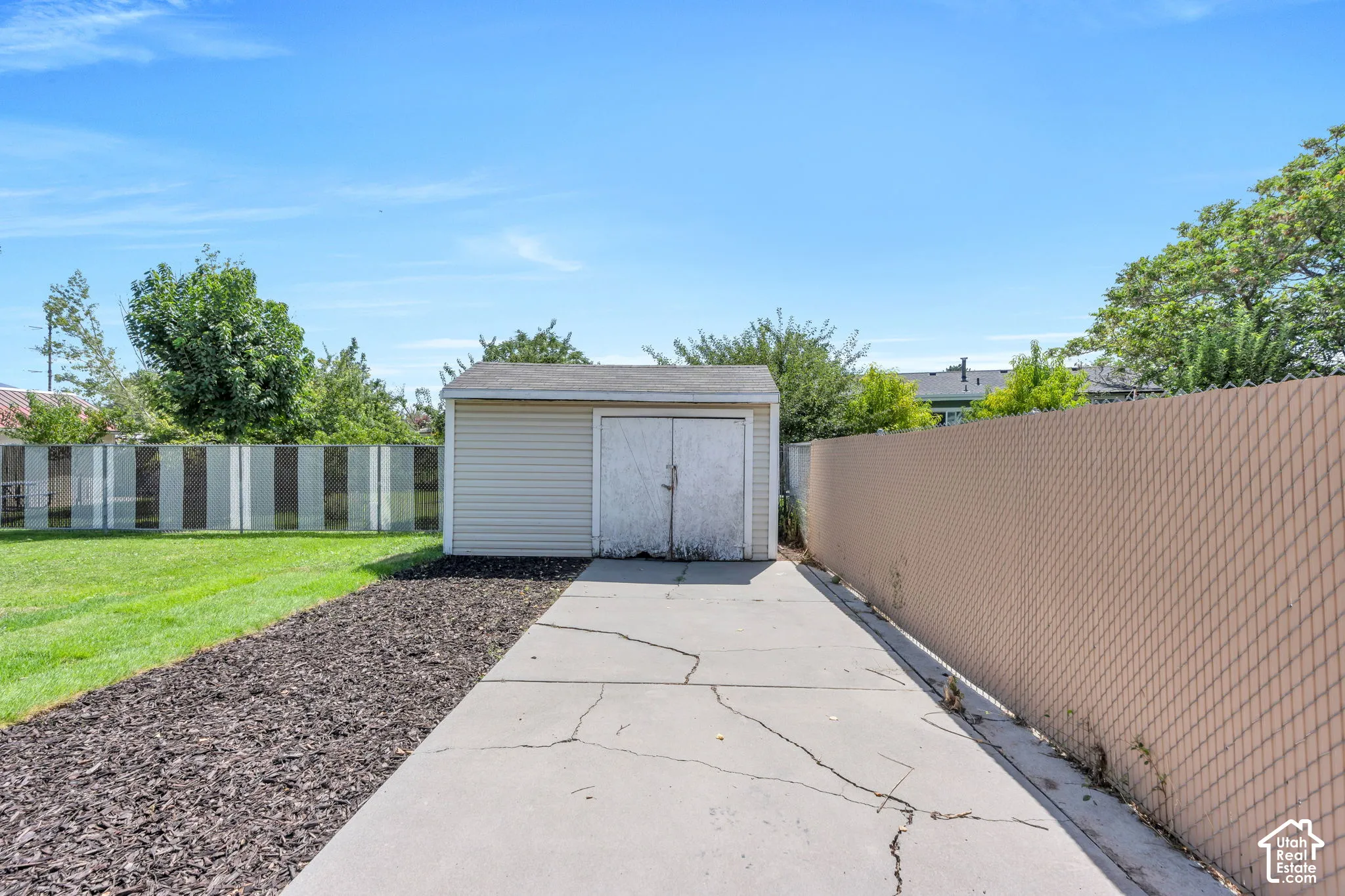Detached shed/garage provides valuable additional storage for tools, equipment and outdoor gear.