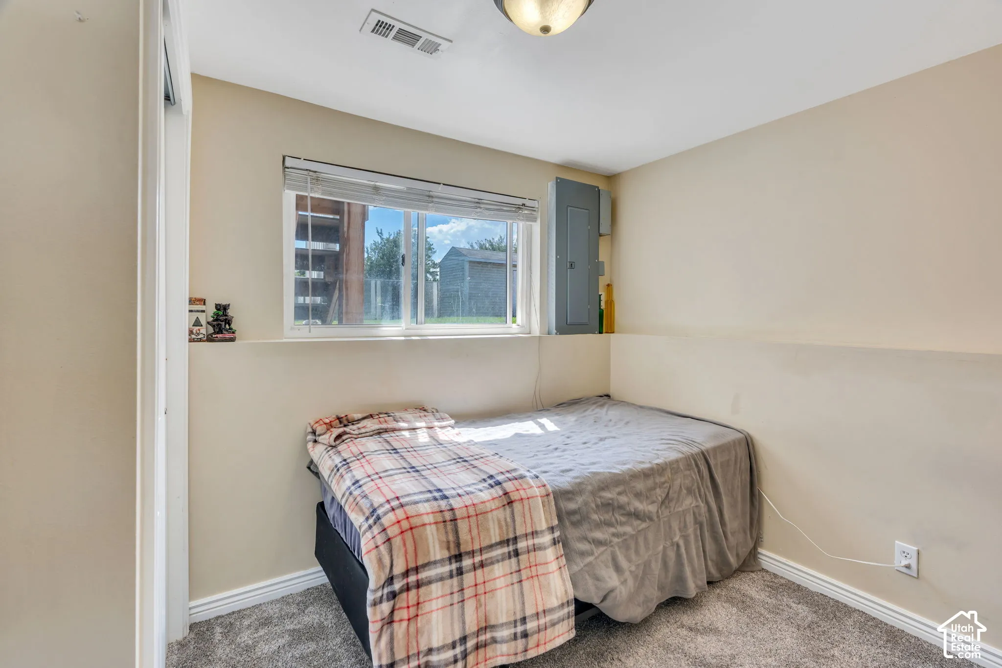 Comfortable lower-level bedroom with daylight windows and flexible use.
