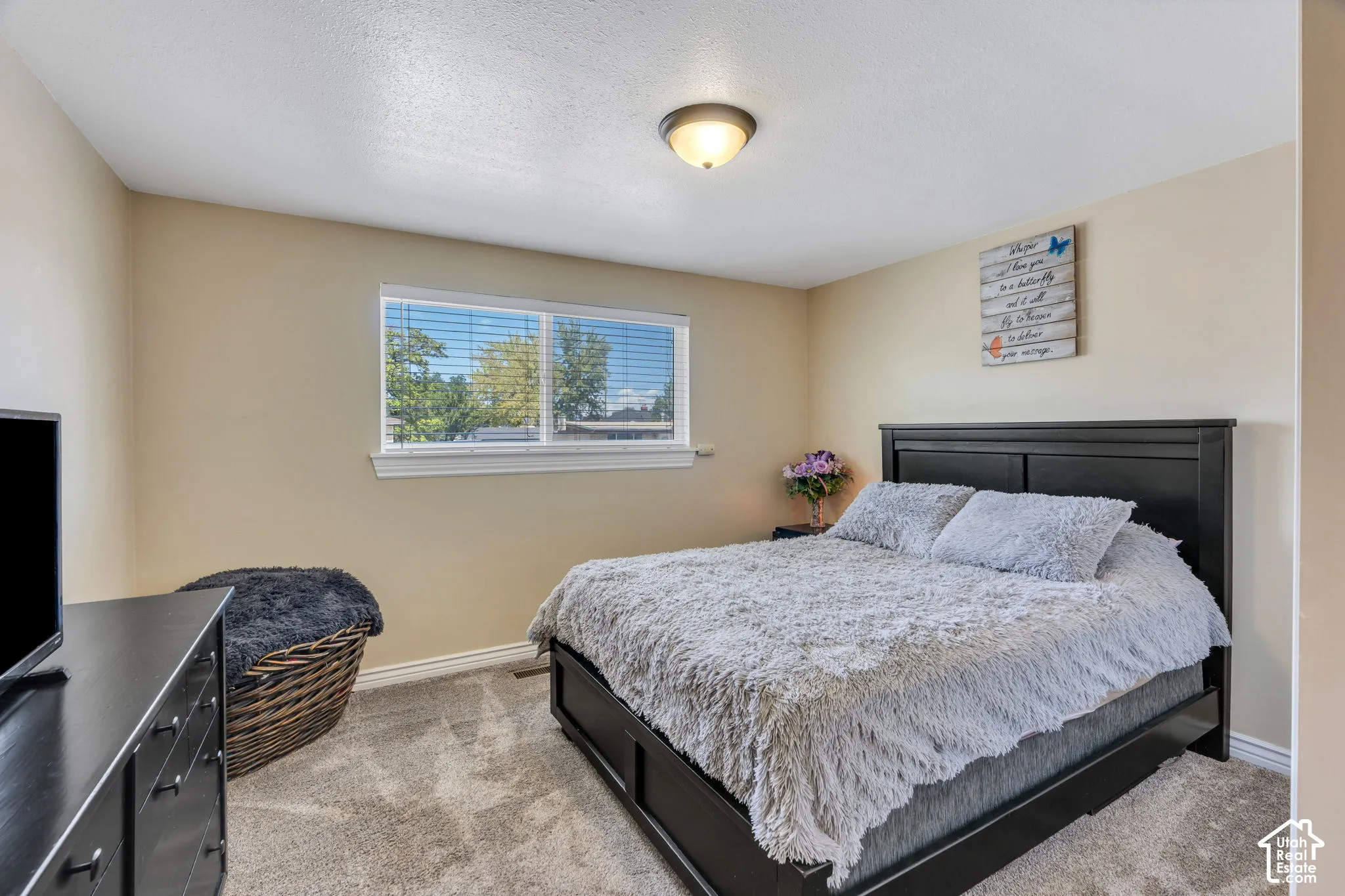 Comfortable bedroom with good natural light and plenty of space for furnishings.