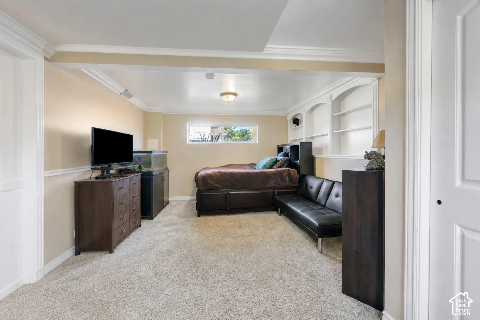 Generously sized downstairs bedroom with direct access to the adjoining bathroom—an excellent option for a second primary suite.