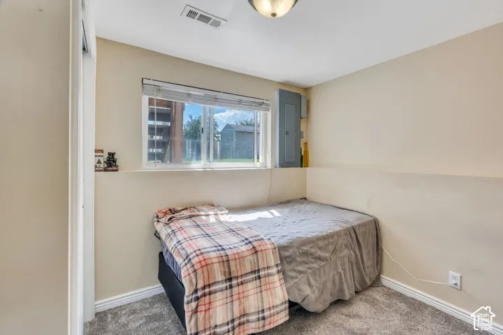Comfortable lower-level bedroom with daylight windows and flexible use.